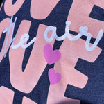 love is in the air graphic tee